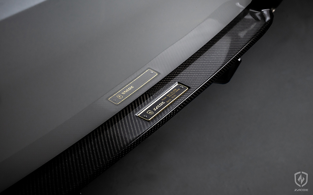 Customized serial badge number on a carbon fiber diffuser for BMW G20 320i Sedan.
