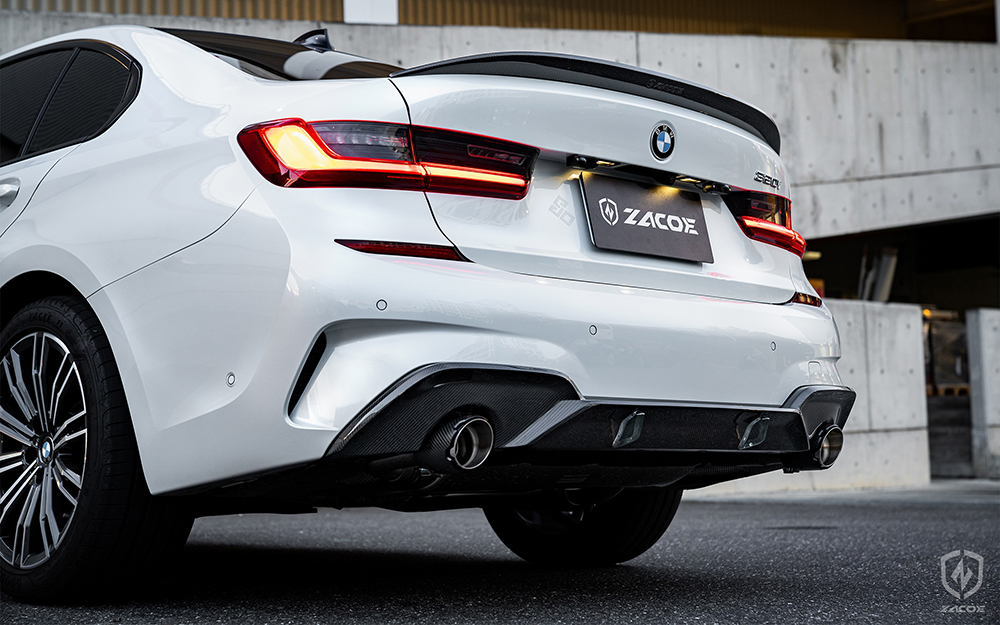 Carbon fiber side skirt and diffuser installed on BMW G20 320i Sedan.