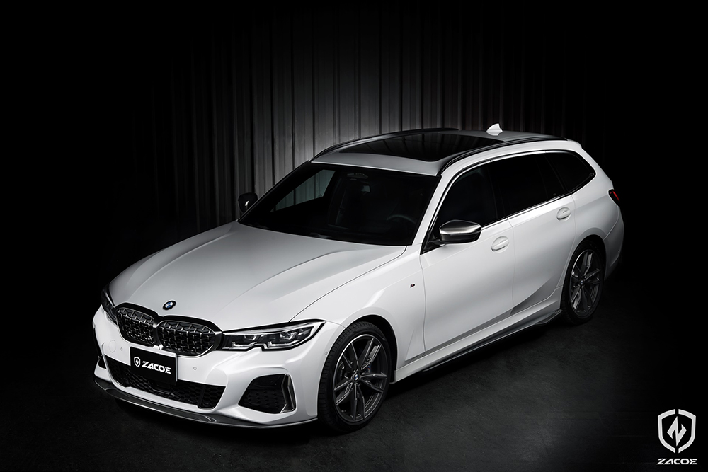 Carbon fiber side skirt and front lip installed on BMW G21 M340i Touring.